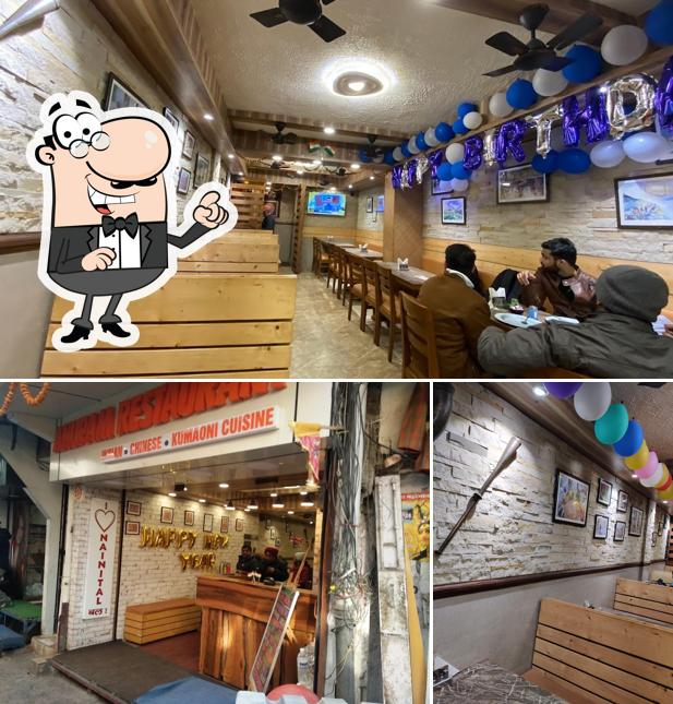 Take a seat at one of the tables at Anupam Restaurant