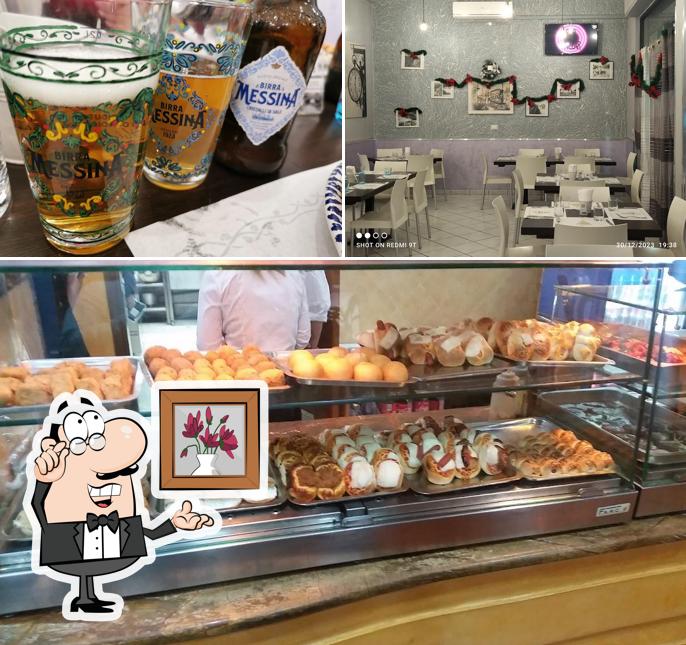 Questa è la immagine che mostra la interni e bevanda di A ferrovia srl Pizzeria - Polleria - Gastronomia -Villabate