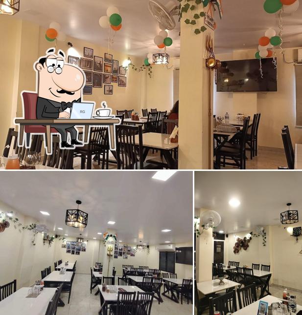 Take a seat at one of the tables at De Once More Cafe & Restaurant Best Restaurant in Varanasi Best Cafe in Varanasi