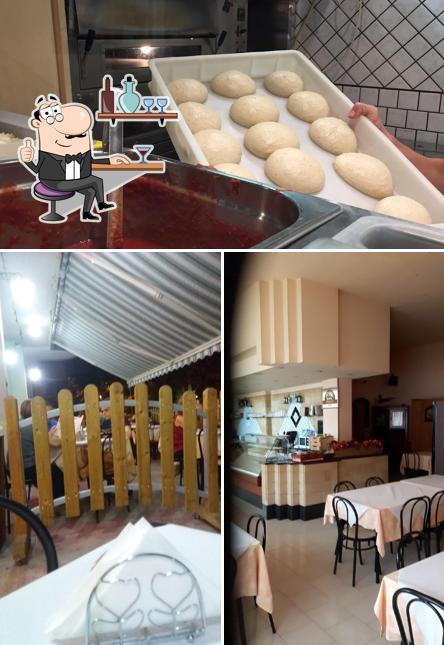 Dai un’occhiata alla foto che mostra la interni e cibo di Calabash pizzeria