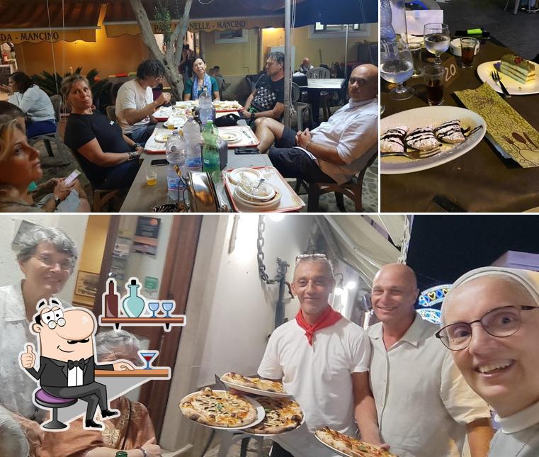 La foto di interni e cibo da Pizzeria trattoria L'ancora