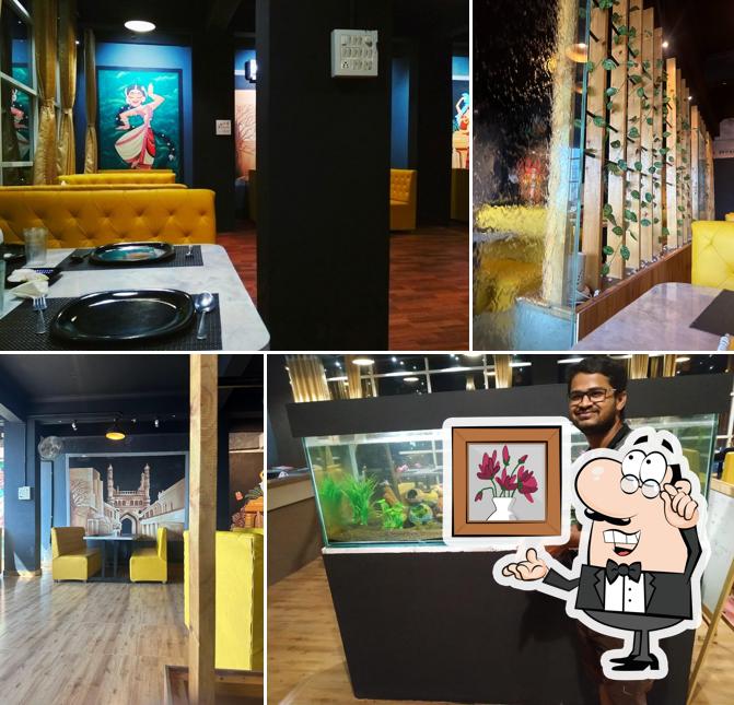 Take a seat at one of the tables at Sri Rajdhani Restaurant