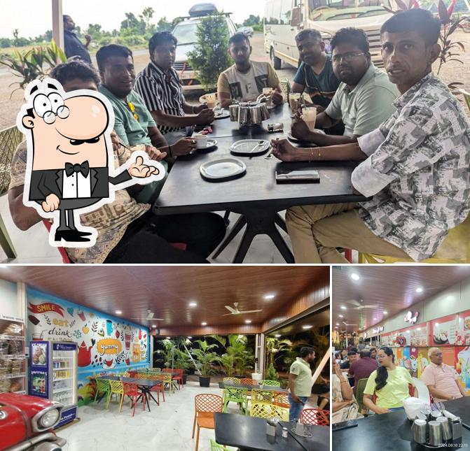 Take a seat at one of the tables at Hotel Shiva Punjab Inn, MH 41 Foodcourt