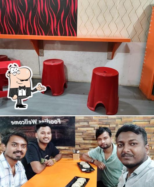 Take a seat at one of the tables at As-14 WoW! Momos and Bhojanaloy