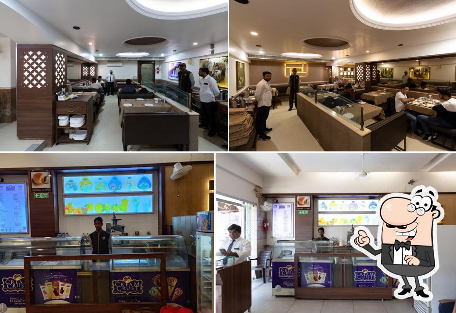 Take a seat at one of the tables at SUNRISE RESTAURANT