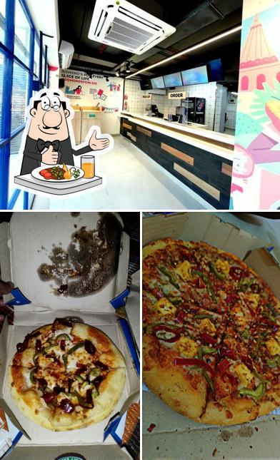 This is the image depicting food and interior at Domino's Pizza Shyam Nagar, Mumbai