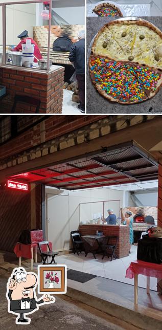 O interior do AJM Pizzaria e Esfiharia