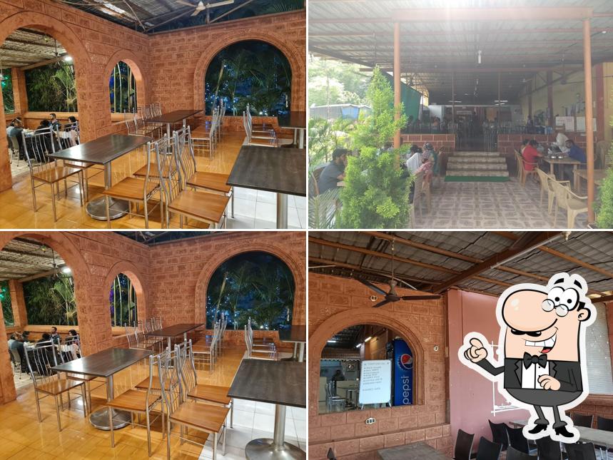 Take a seat at one of the tables at Hotel Mast Malwani khed