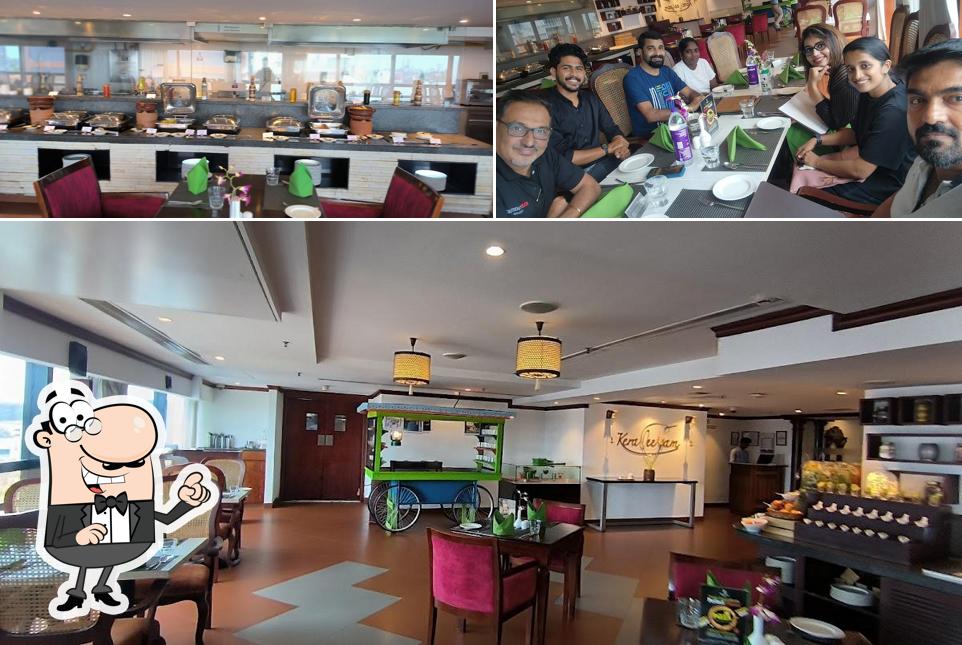 Take a seat at one of the tables at Keraleeyam Restaurant at The Raviz Calicut