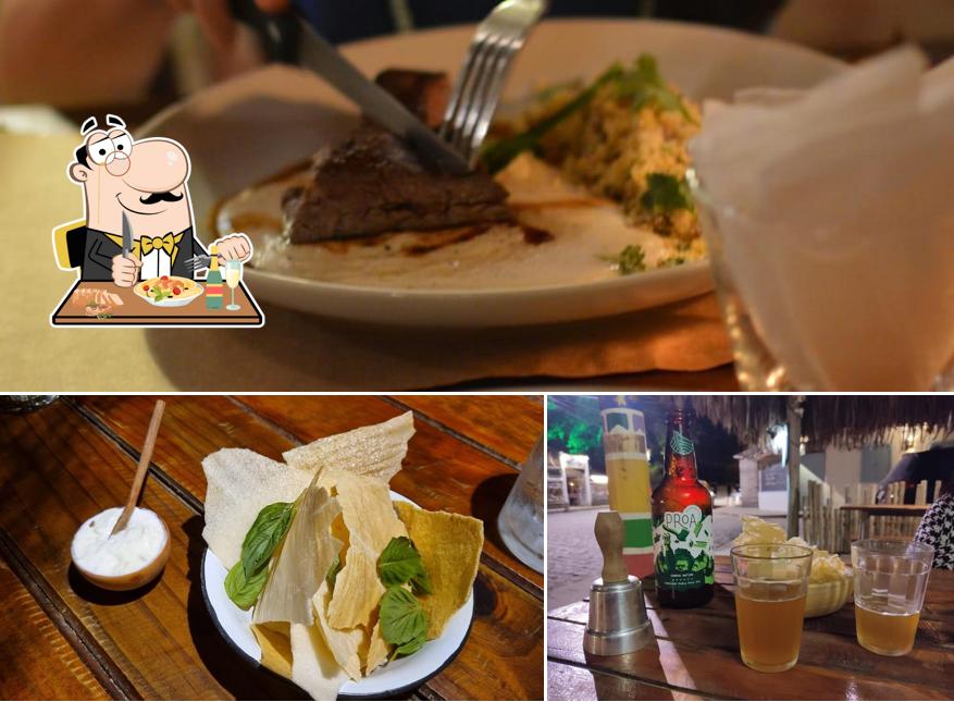 A imagem da comida e cerveja a São João Batista Burger & Pizza