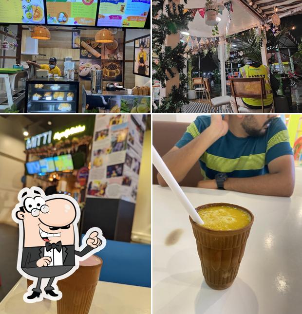Check out the image showing interior and food at Mitti - Magic of abilities