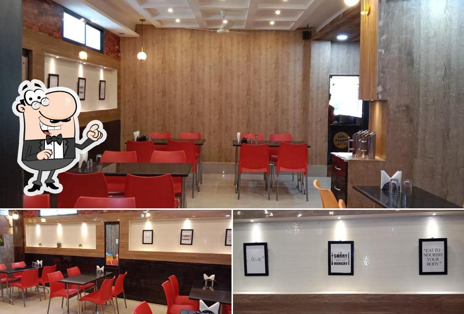 Take a seat at one of the tables at Salt and Pepper Restaurant