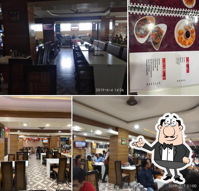 Take a seat at one of the tables at Naveen's Bapu ki Kutiya