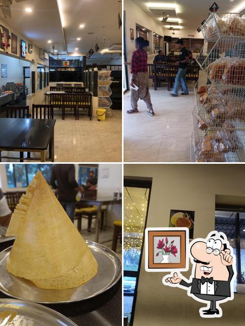 Take a seat at one of the tables at Swamy's Vaibhavam Pure Veg Restaurant