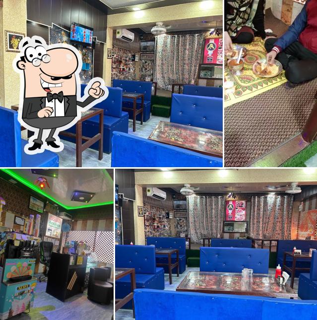 Take a seat at one of the tables at Arabian Pizza and Burger