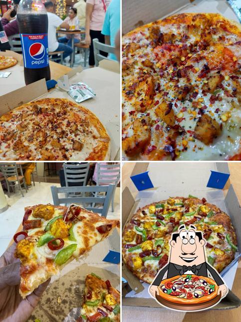 Try out pizza at Domino's Pizza