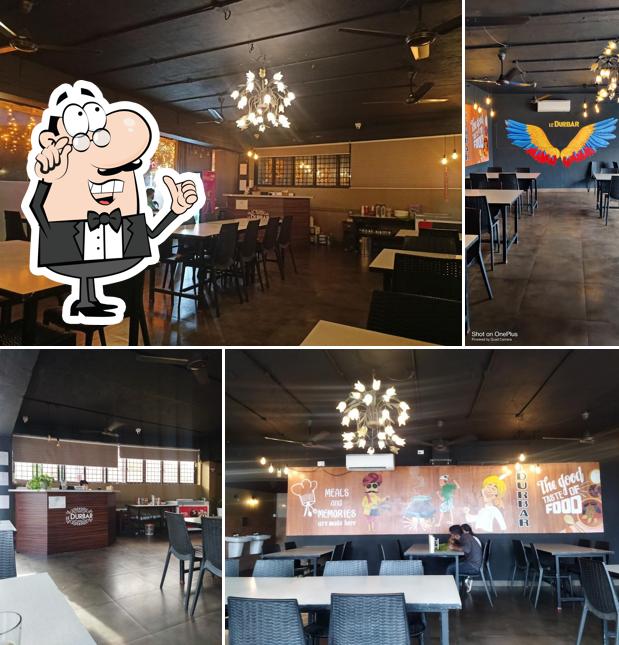 Take a seat at one of the tables at Le Durbar