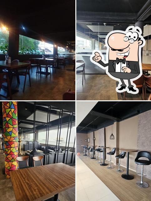 Take a seat at one of the tables at Hotel Lakshmi Family Restaurant (BAR Attached)