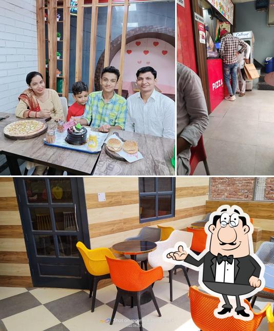 Take a seat at one of the tables at Pizza Xitement