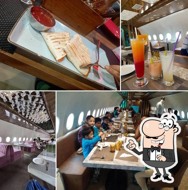 Take a seat at one of the tables at Aerodine Restaurant