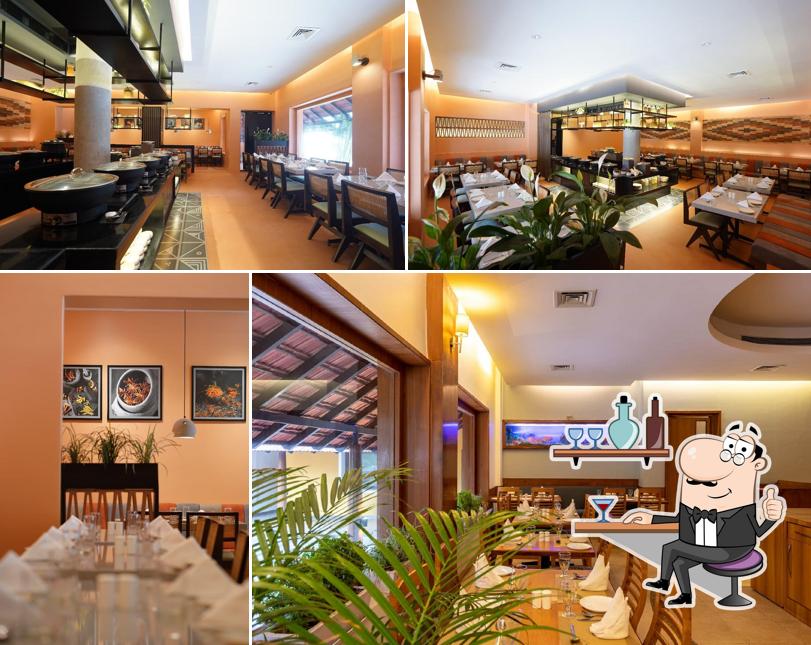 Take a seat at one of the tables at The Spice Table - Kwality's Motel Shiraz