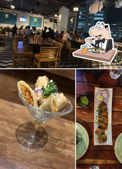 Check out the picture displaying food and interior at Tiddly Tavern Bar & Grill