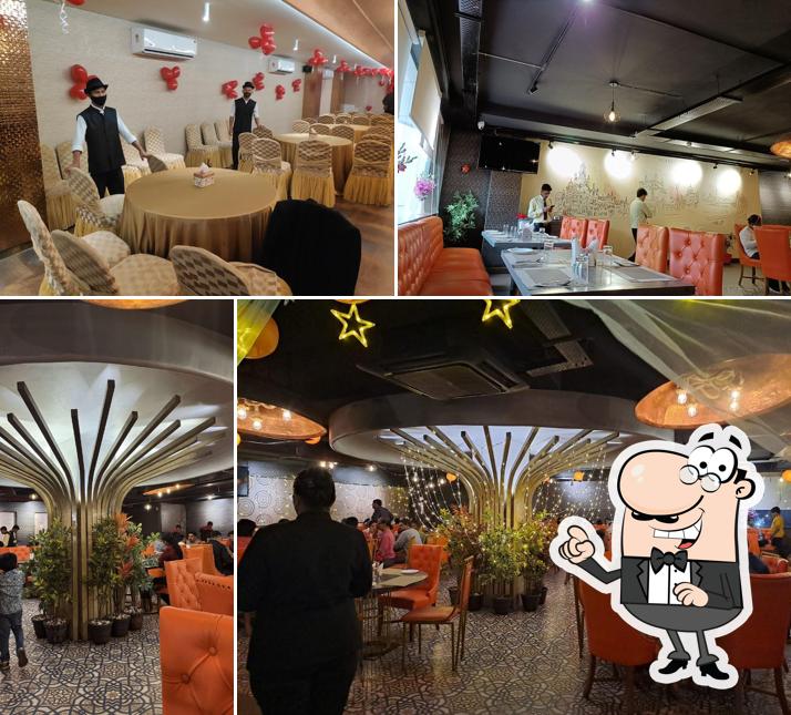 Take a seat at one of the tables at Mumbai Masalaa - Narayanguda