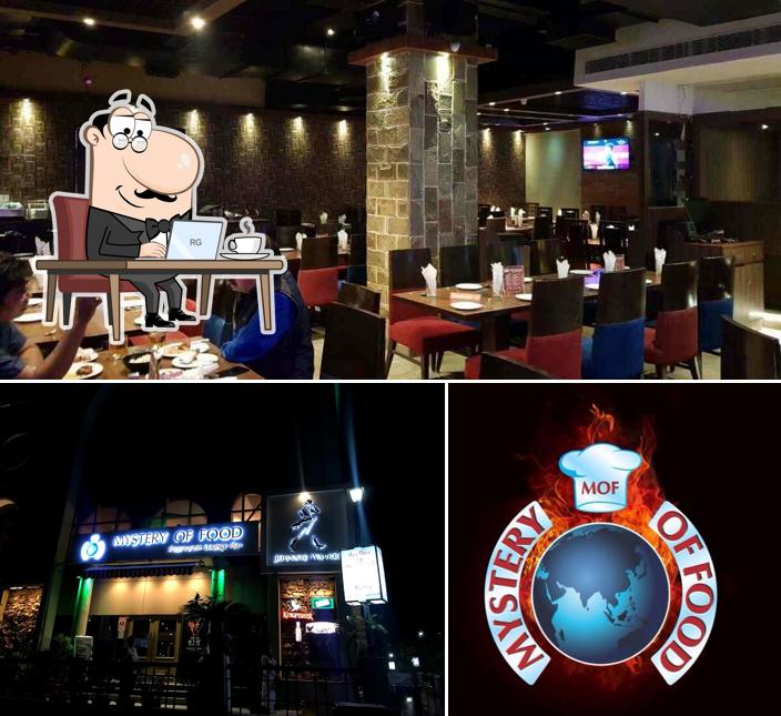 Take a seat at one of the tables at Mystery of Food Restaurant and Bar