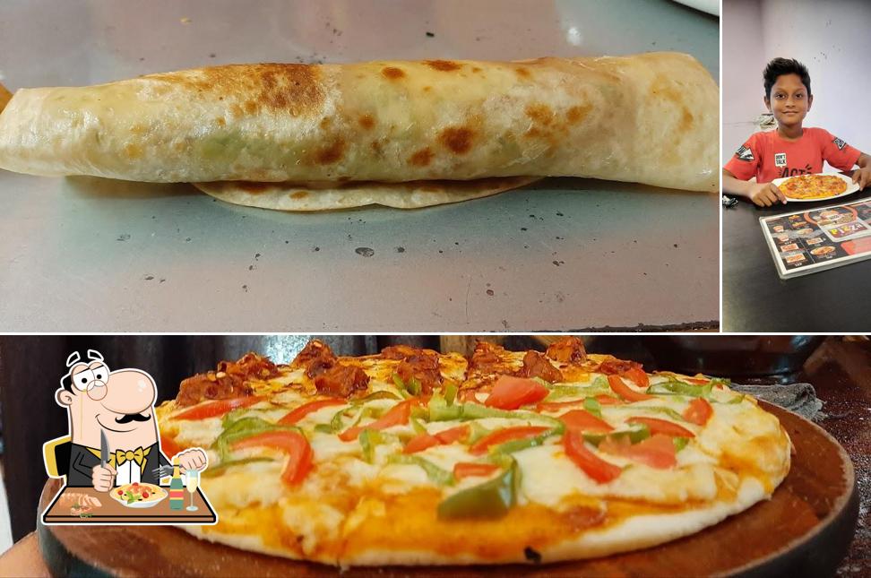 This is the picture depicting food and interior at Pizza Estate