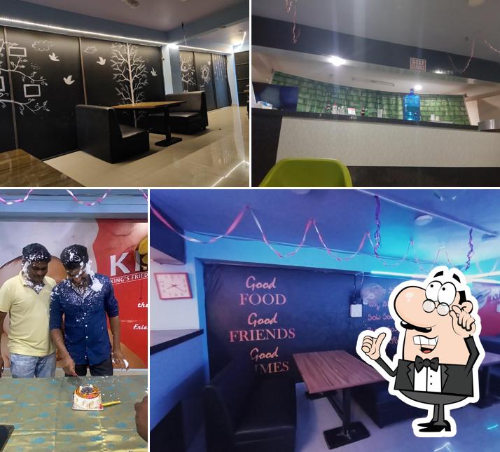 Take a seat at one of the tables at Kings Fried Chicken (KFC), pulivendula