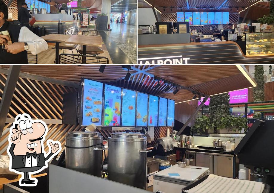 Take a seat at one of the tables at Chai Point - Gaur City Mall