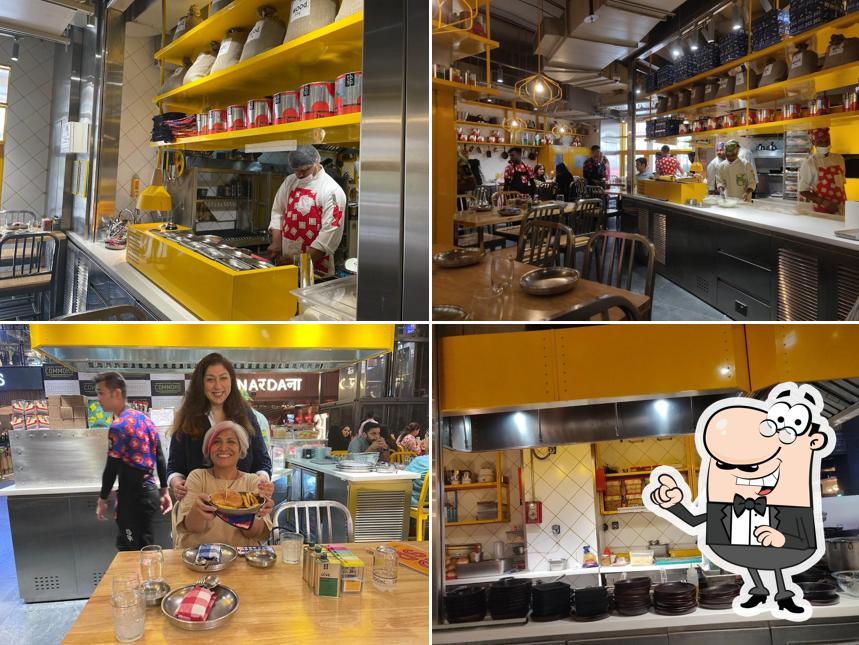 Take a seat at one of the tables at tbsp. - Tablespoon / Pizza, Pasta, BBQ