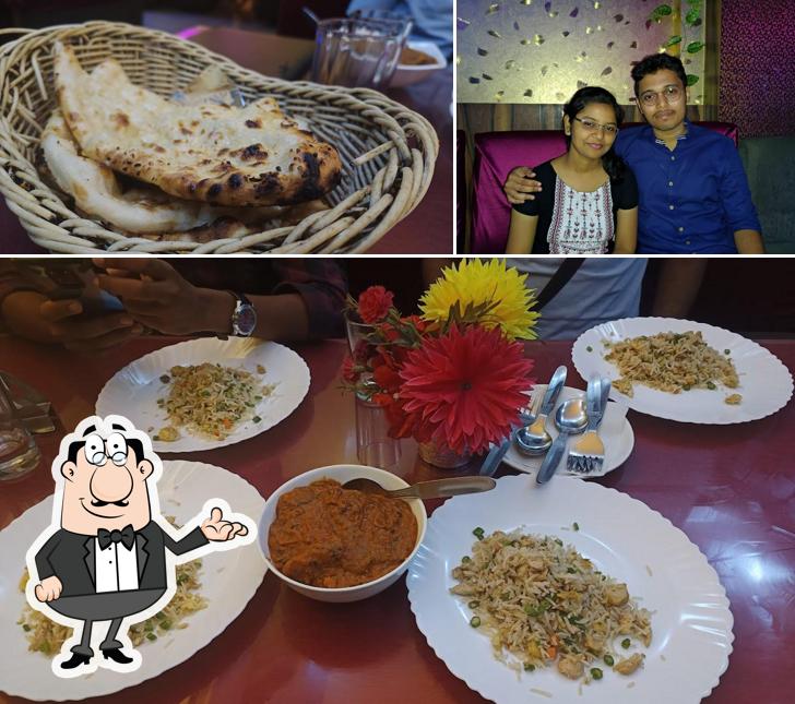 The photo of interior and food at Nilam Restaurant