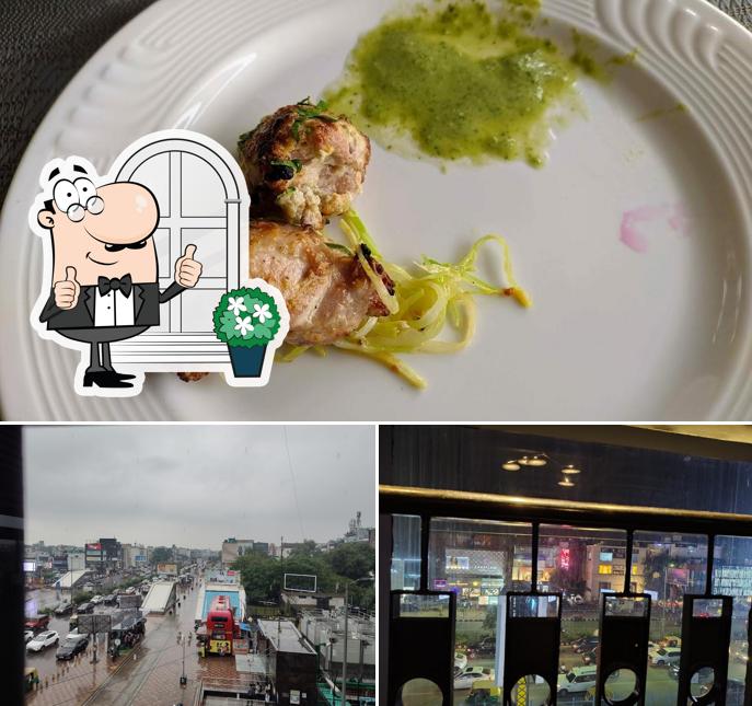 Take a look at the photo displaying exterior and food at Moti Mahal Delux