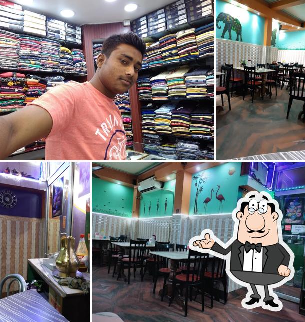 Take a seat at one of the tables at Ajanta Hotel & Restaurant