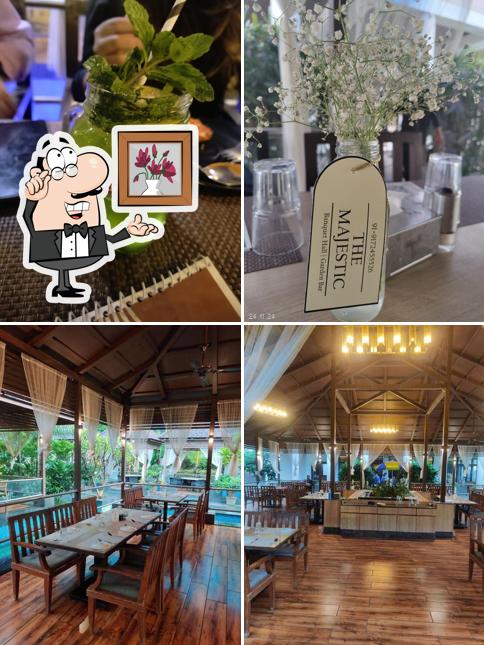 Take a seat at one of the tables at Hotel Blu Grass Banquet Fine Dine Restaurant