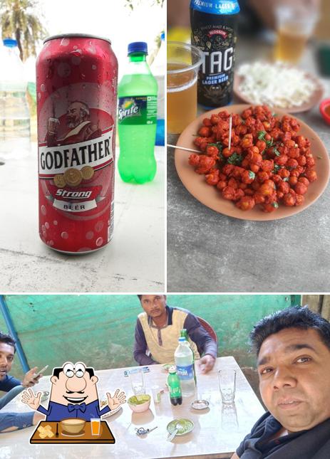 Among various things one can find food and dining table at RK Dhabha