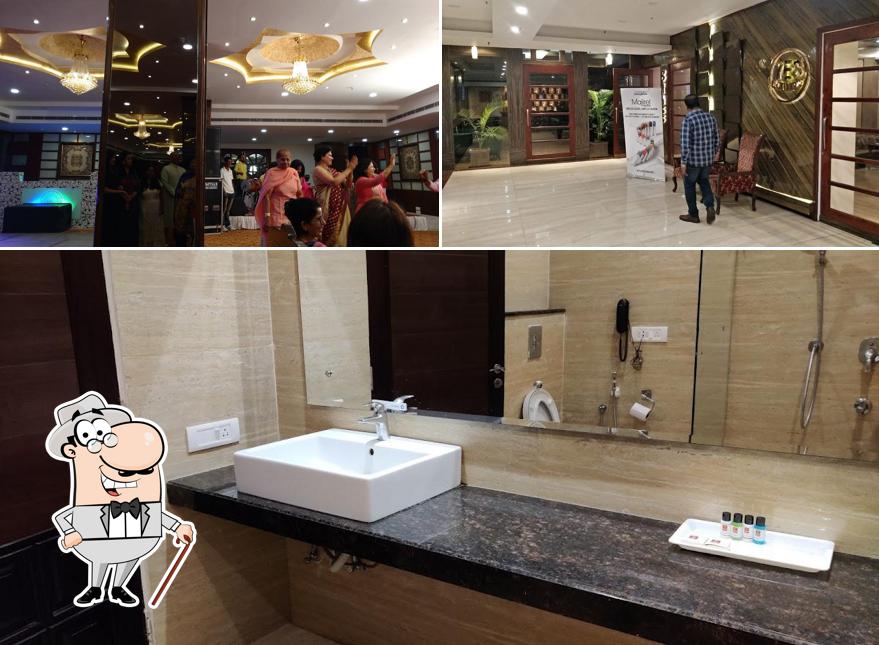 Take a look at the photo displaying exterior and interior at Hotel Clarion Inn AMPS