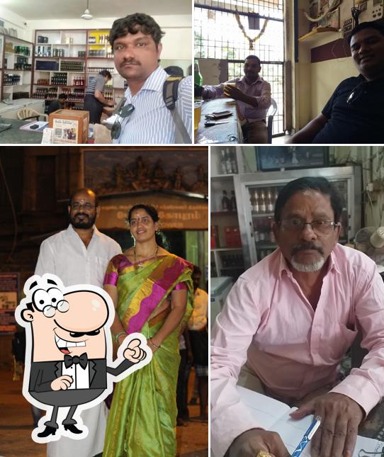 Take a seat at one of the tables at Sri Sai krishna bar