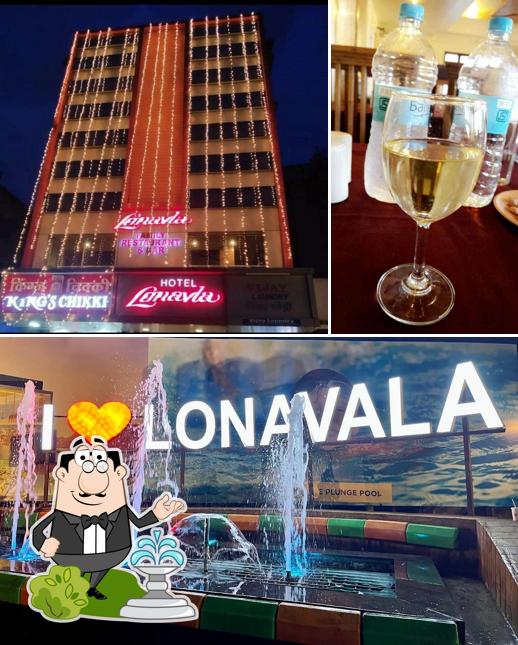The picture of exterior and wine at Lonavla Restaurant and Bar