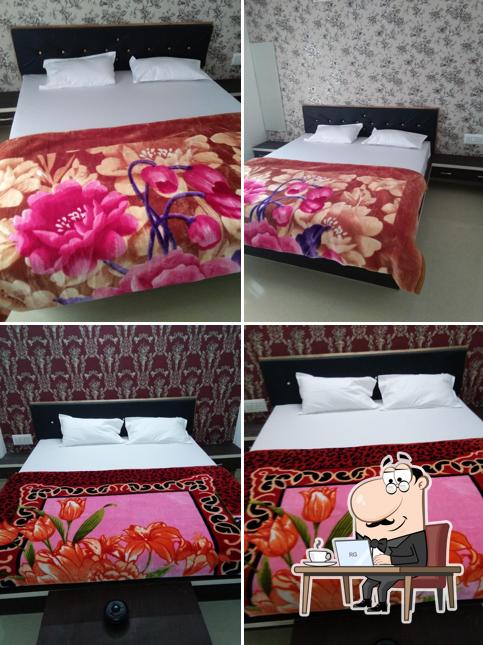 Take a seat at one of the tables at Hotel Red Rose Palace