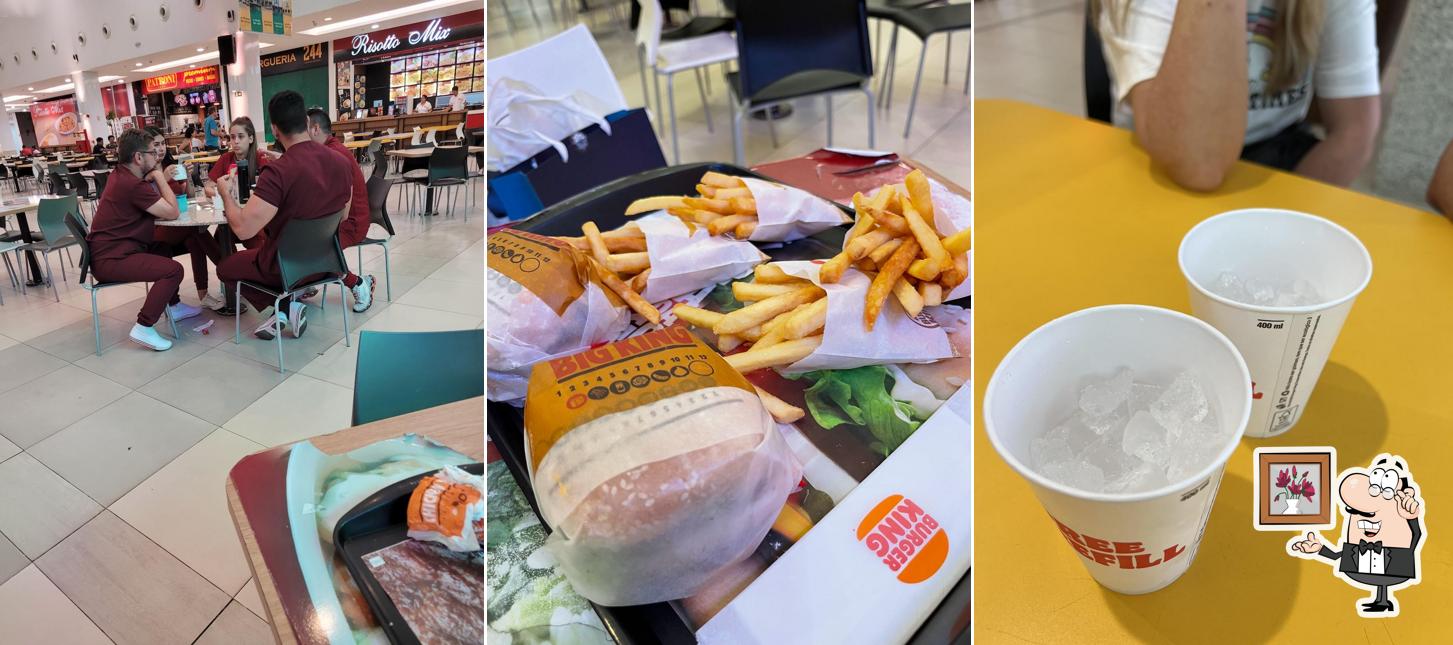 Sente em uma das mesas no Burger King
