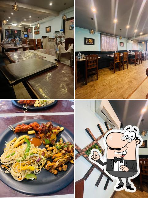 Take a seat at one of the tables at Swagat Restaurant