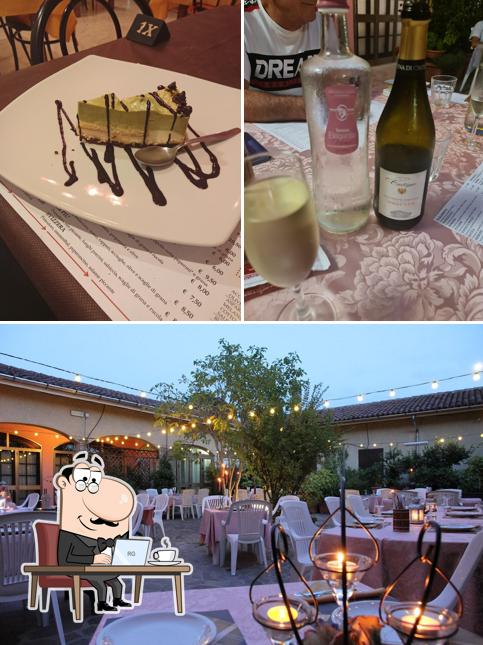 Questa è la foto che presenta la interni e cibo di Ristorante Pizzeria Da Guido