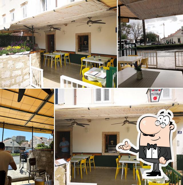 Dai un'occhiata agli interni di Pizzeria Tomato