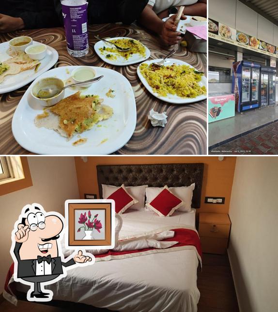 Take a seat at one of the tables at HOTEL PARIVAR GARDEN All VEG AND DELUXE ROOMS