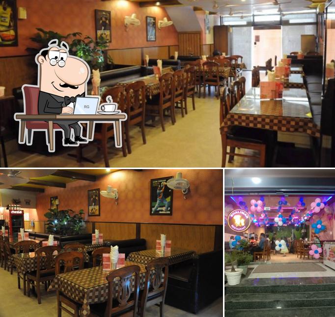 Take a seat at one of the tables at Shalimar Family Restaurant