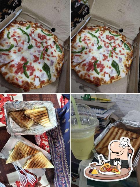 Pick pizza at Moody Cup Cafe & Restro