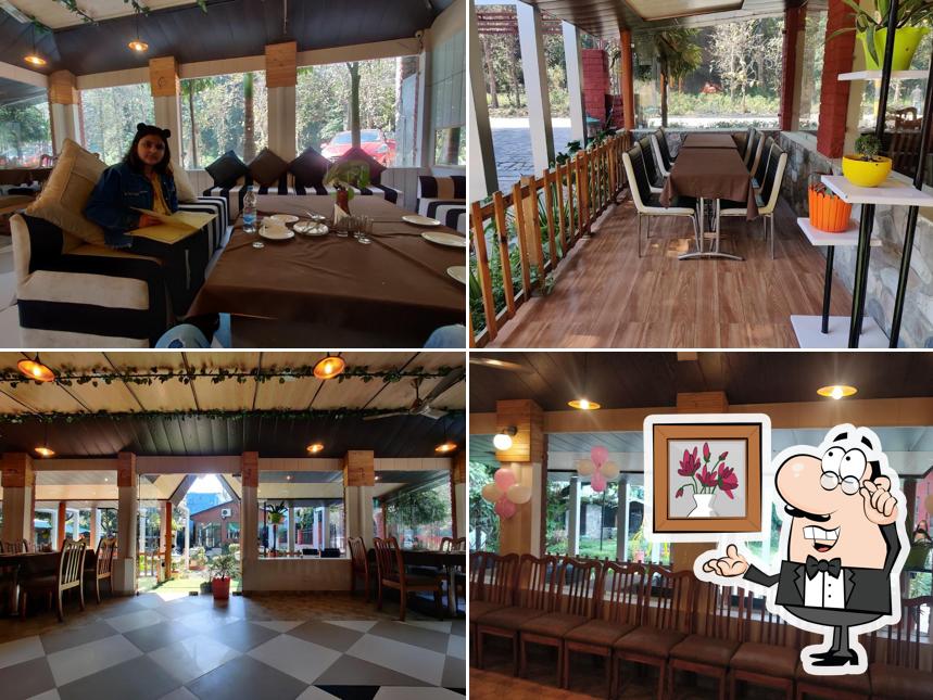 Take a seat at one of the tables at Bageecha Multicuisine Restaurant