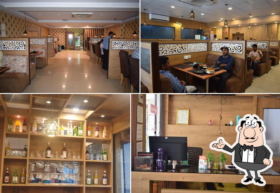 Take a seat at one of the tables at Bilal Family and Multicuisine Restaurant